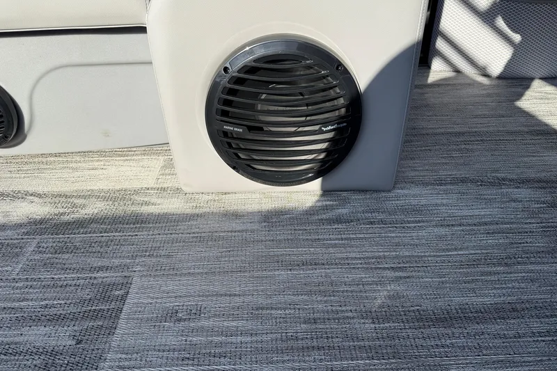 Slide: The Image of Marine speaker on Bentley Pontoons Legacy 243 Navigator 2026, with textured flooring. - 25