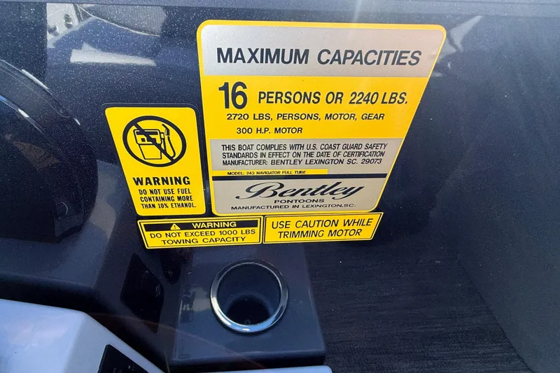 Slide: The Image of Capacity warning label on 2026 Bentley Pontoons Legacy 243 Navigator boat. - 31