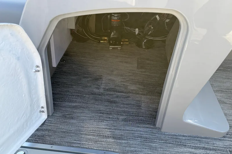 Slide: The Image of Interior view of 2026 Bentley Pontoons Legacy 243 Navigator storage compartment. - 34