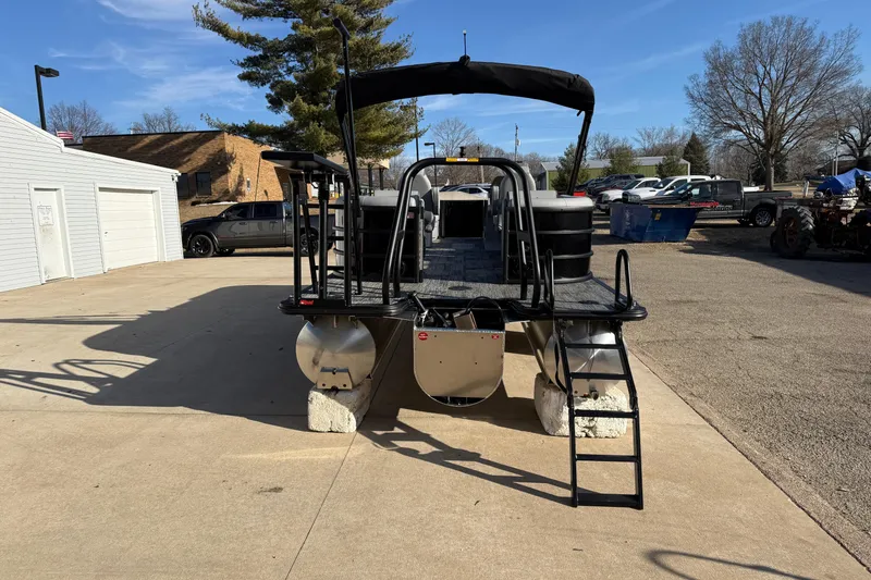 Slide: The Image of 2026 Bentley Pontoons Legacy 243 Navigator on display in a parking lot. - 7
