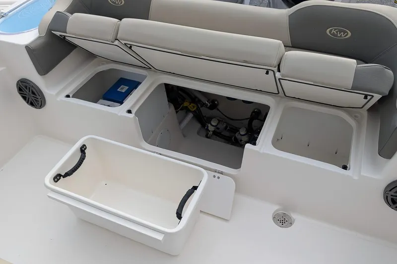 Slide: The Image of Interior view of 2026 Key West 291 FS boat, showcasing storage compartments and seating. - 11