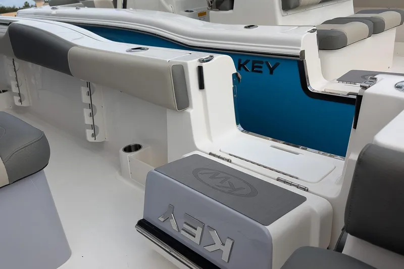 Slide: The Image of 2026 Key West 291 FS boat interior with sleek seating and modern design. - 14