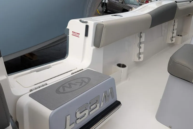 Slide: The Image of 2026 Key West 291 FS boat interior with seating and storage features. - 15