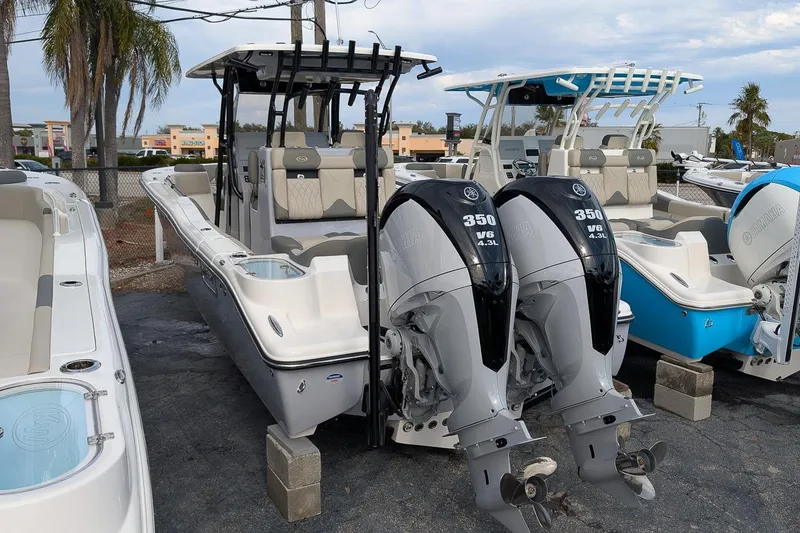 Slide: The Image of 2026 Key West 291 FS boat with dual Yamaha 350 engines, displayed outdoors. - 2