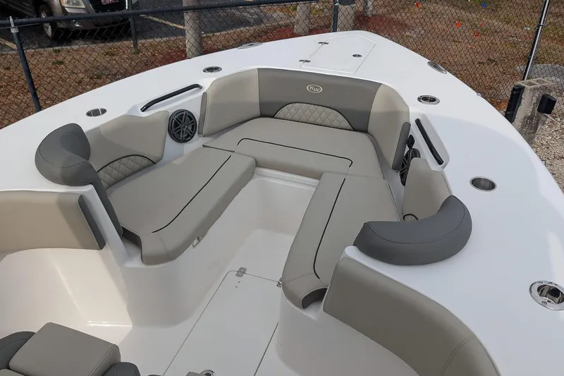 Slide: The Image of 2026 Key West 291 FS boat interior with cushioned seating and cup holders. - 20