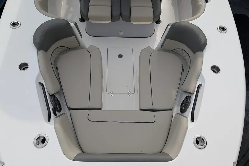 Slide: The Image of 2026 Key West 291 FS boat interior with gray seating and cup holders. - 21