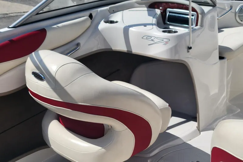Slide: The Image of Interior of a 2014 Tahoe Q7i boat with white and red seating. - 12