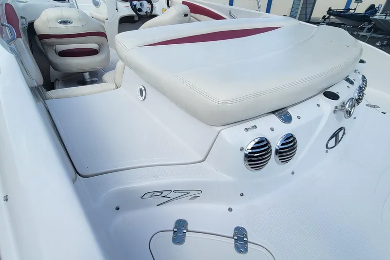 Slide: The Image of 2014 Tahoe Q7i boat interior with white and red seating, sleek design. - 19