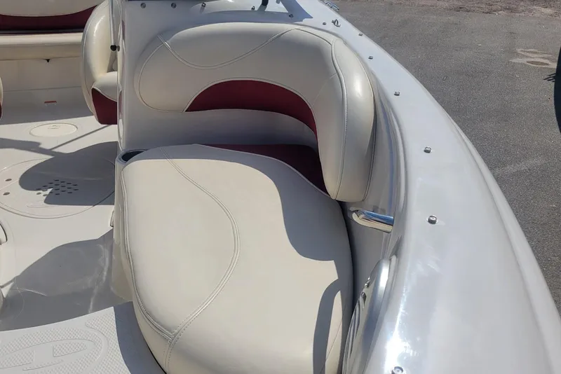 Slide: The Image of 2014 Tahoe Q7i boat interior with white and red cushioned seating. - 8