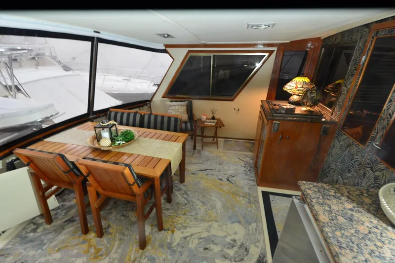 Slide: The Image of Interior of a 1990 Jefferson 52 Marquessa ED yacht with dining area and elegant decor. - 10