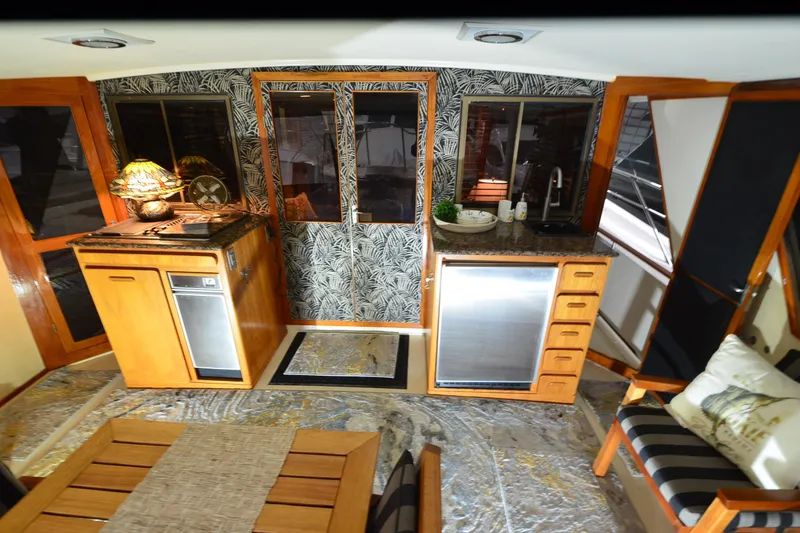 Slide: The Image of Luxurious interior of a 1990 Jefferson 52 Marquessa ED yacht with modern kitchen amenities. - 11