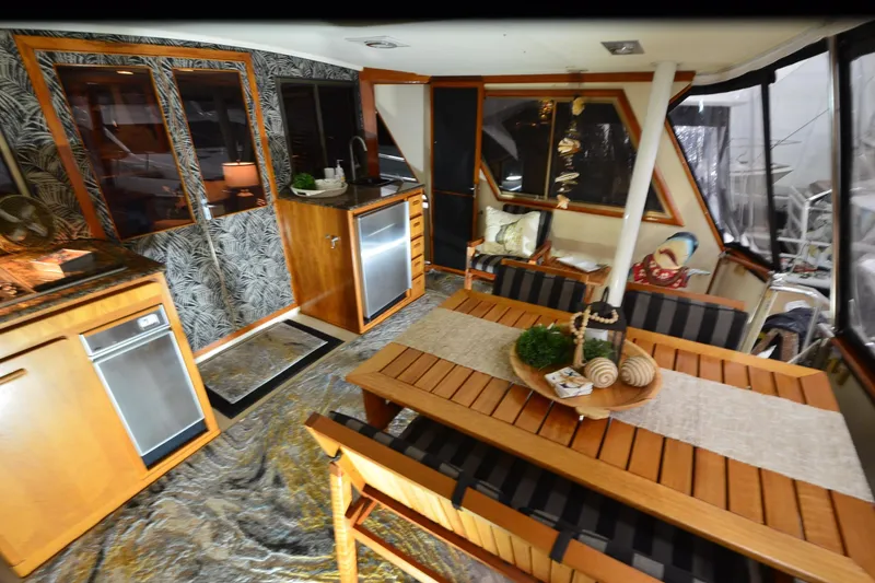Slide: The Image of Interior of a 1990 Jefferson 52 Marquessa ED yacht with elegant wood furnishings. - 12