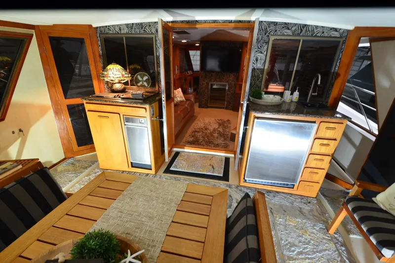 Slide: The Image of Luxurious interior of a 1990 Jefferson 52 Marquessa ED yacht with elegant wood finishes. - 13