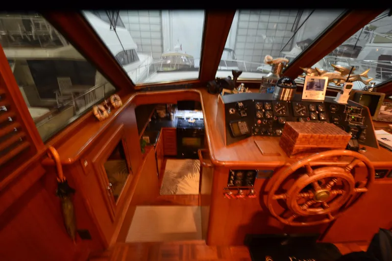 Slide: The Image of Interior view of 1990 Jefferson 52 Marquessa ED yacht helm with wooden steering wheel and control panel. - 14