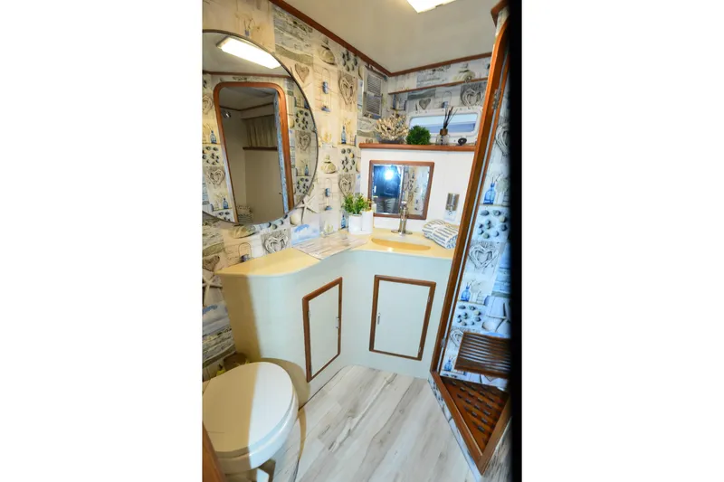 Slide: The Image of Bathroom interior of 1990 Jefferson 52 Marquessa ED yacht with nautical decor. - 20