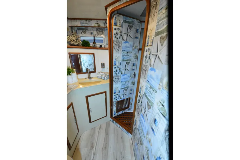 Slide: The Image of Bathroom interior of 1990 Jefferson 52 Marquessa ED yacht with nautical-themed decor. - 21