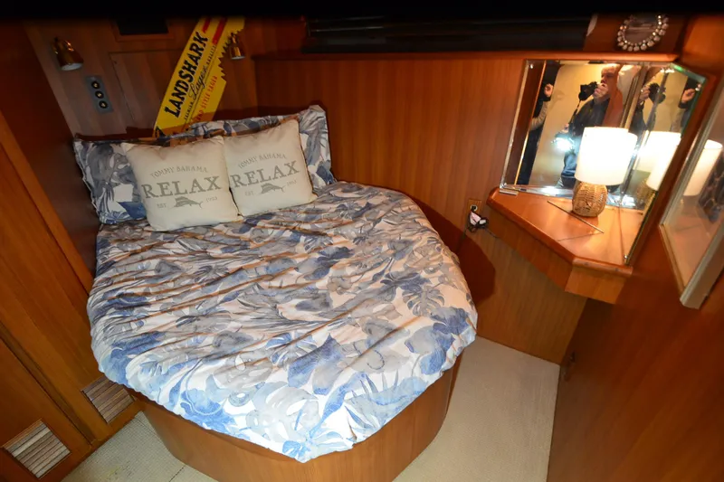 Slide: The Image of Cozy bedroom in 1990 Jefferson 52 Marquessa ED yacht with floral bedding and warm lighting. - 23
