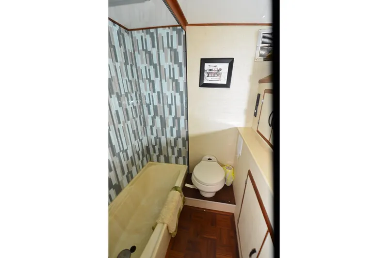 Slide: The Image of Bathroom interior of 1990 Jefferson 52 Marquessa ED yacht with tub and toilet. - 26
