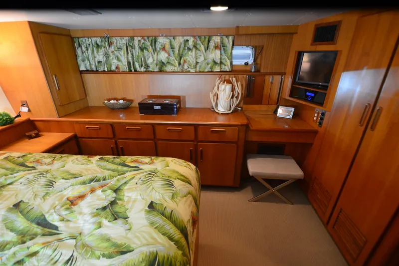 Slide: The Image of Luxurious 1990 Jefferson 52 Marquessa ED yacht bedroom with tropical decor and wooden cabinetry. - 28