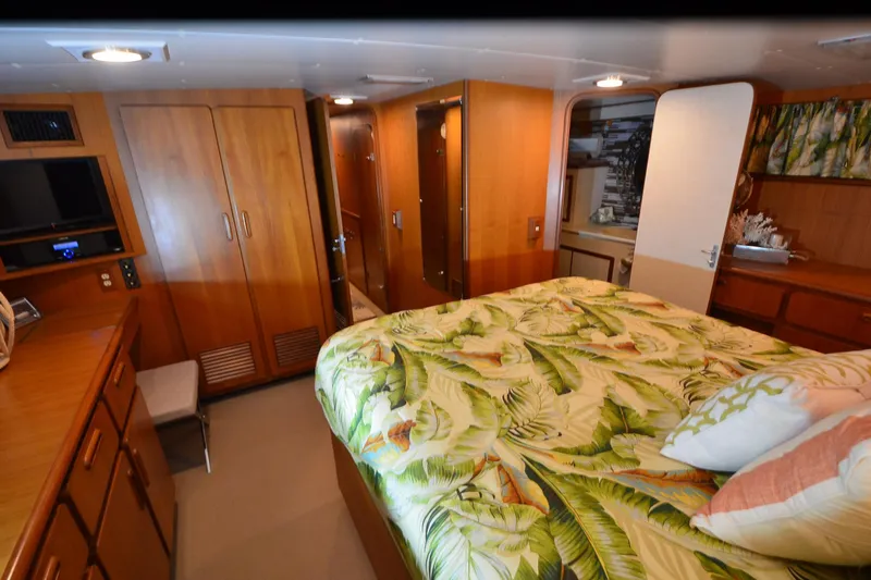 Slide: The Image of Luxurious cabin interior of 1990 Jefferson 52 Marquessa ED yacht with tropical bedding. - 30