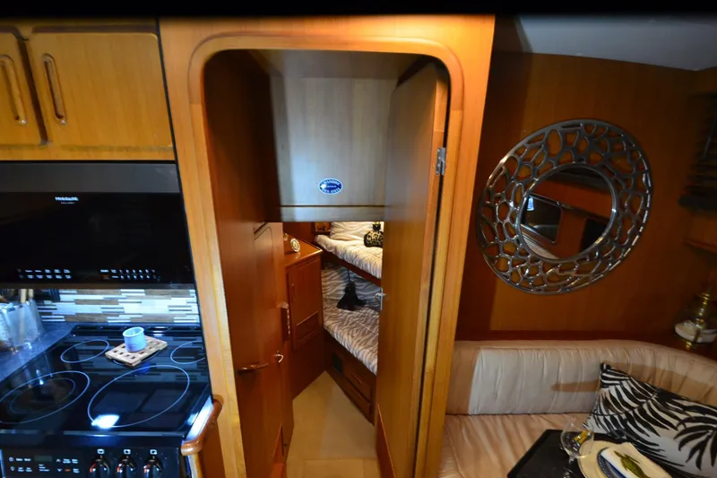 Slide: The Image of Interior of 1990 Jefferson 52 Marquessa ED yacht with kitchen and cozy seating area. - 34