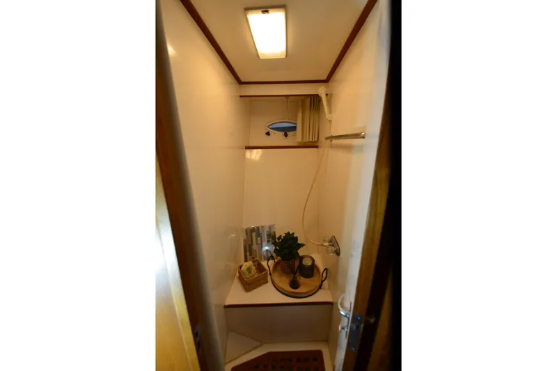Slide: The Image of Compact bathroom in 1990 Jefferson 52 Marquessa ED yacht, featuring shower and decor. - 36