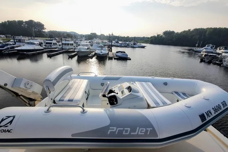 Slide: The Image of Inflatable boat on Jefferson 52 Marquessa ED, 1990, docked at marina with other boats. - 4