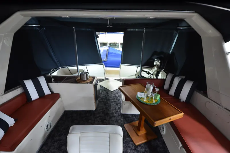 Slide: The Image of Interior of 1990 Jefferson 52 Marquessa ED yacht with seating and table setup. - 45