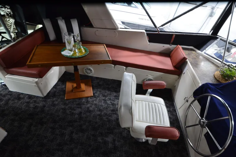 Slide: The Image of Interior of 1990 Jefferson 52 Marquessa ED yacht with seating, table, and helm. - 47