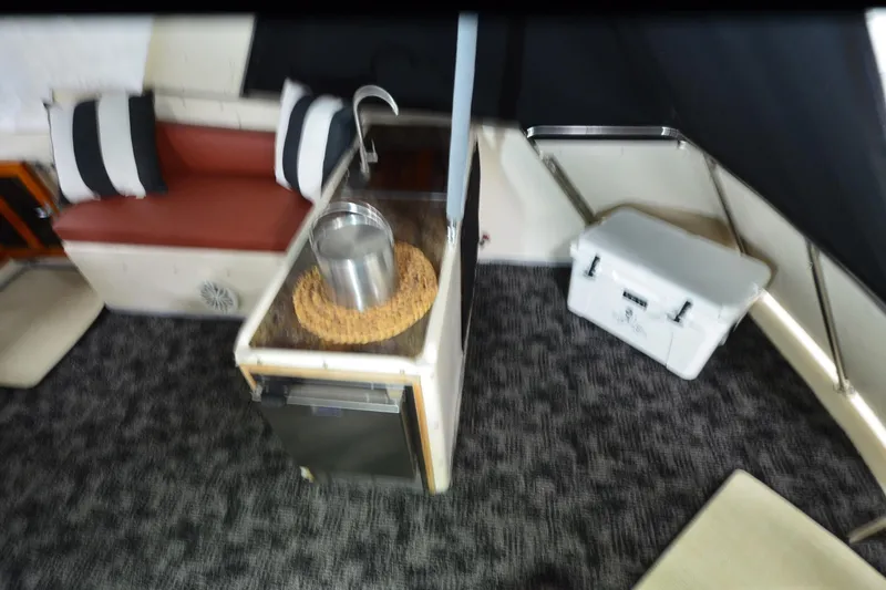 Slide: The Image of Interior of 1990 Jefferson 52 Marquessa ED yacht with seating and cooler. - 50