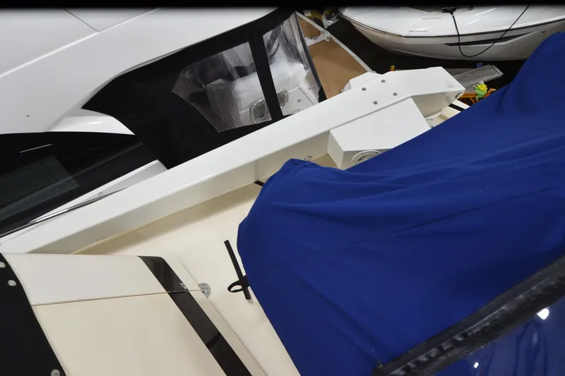 Slide: The Image of 1990 Jefferson 52 Marquessa ED yacht with blue cover and white detailing. - 52