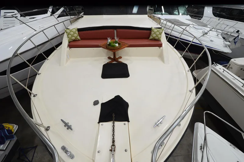 Slide: The Image of Deck of 1990 Jefferson 52 Marquessa ED yacht with seating and table. - 58
