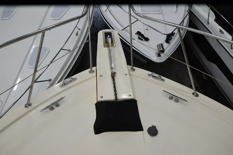 Slide: The Image of Bow of 1990 Jefferson 52 Marquessa ED yacht with anchor chain and railings. - 61