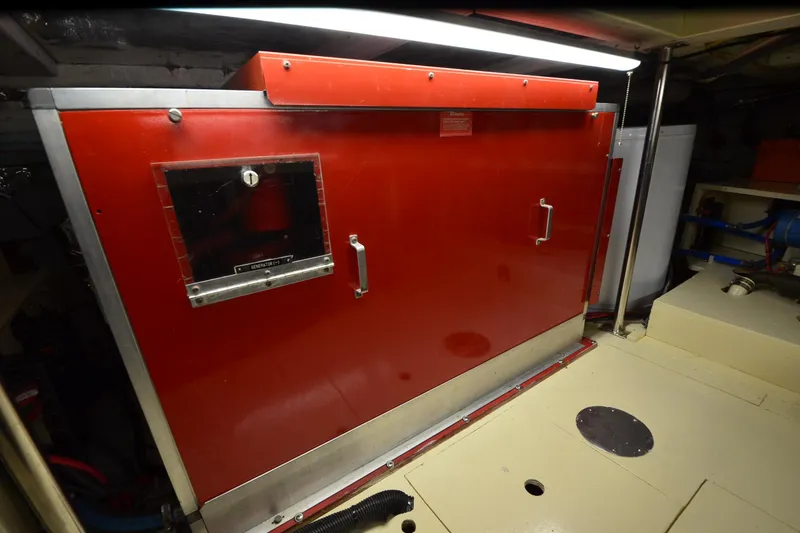 Slide: The Image of Engine room of 1990 Jefferson 52 Marquessa ED with red generator enclosure. - 69