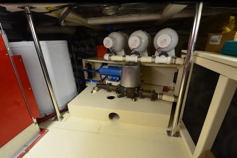 Slide: The Image of Engine room of 1990 Jefferson 52 Marquessa ED yacht, featuring mechanical equipment and piping. - 70