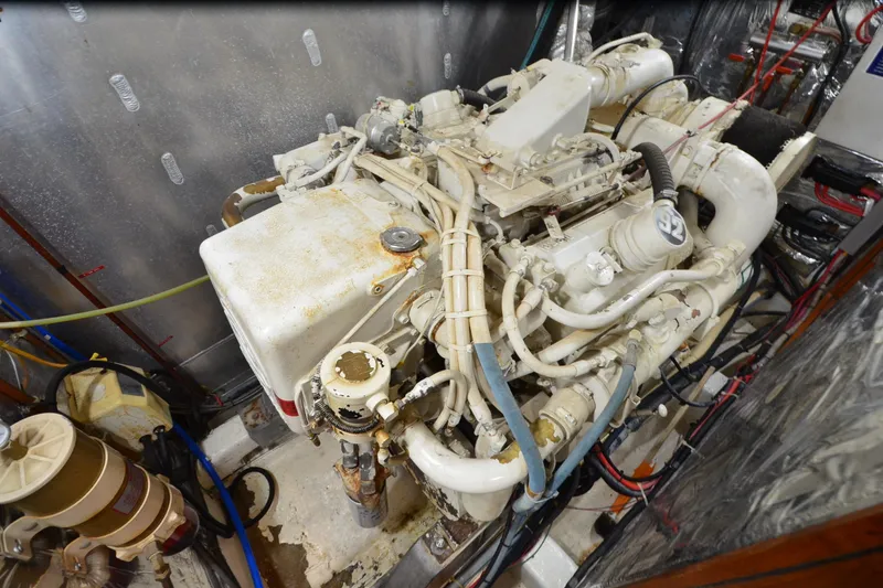 Slide: The Image of Engine room of a 1990 Jefferson 52 Marquessa ED yacht, showcasing complex machinery. - 72