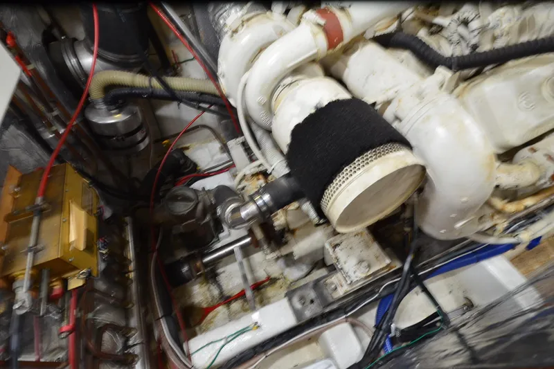 Slide: The Image of Engine room of a 1990 Jefferson 52 Marquessa ED yacht, showcasing mechanical components. - 74