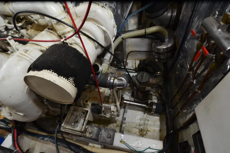 Slide: The Image of Engine room of a 1990 Jefferson 52 Marquessa ED yacht, showcasing mechanical components. - 75