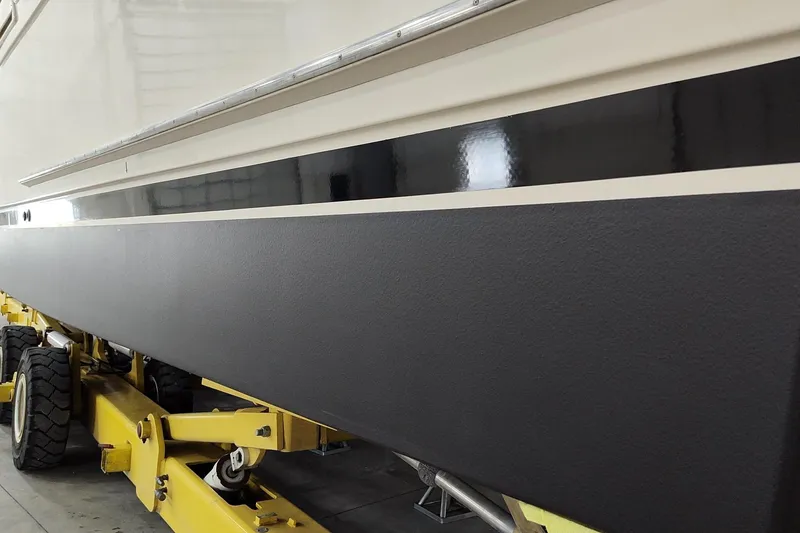 Slide: The Image of 1990 Jefferson 52 Marquessa ED yacht on yellow trailer in a garage. - 9