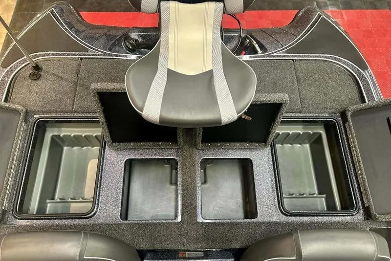Slide: The Image of 2026 Triton 18 TrX boat interior with storage compartments and seating. - 15