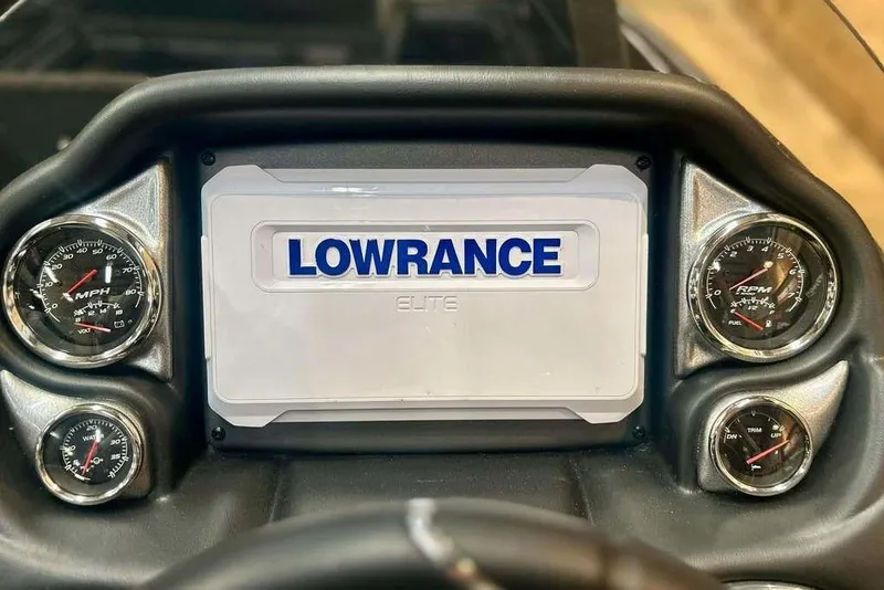 Slide: The Image of Dashboard of 2026 Triton 18 TrX with Lowrance Elite display and gauges. - 2