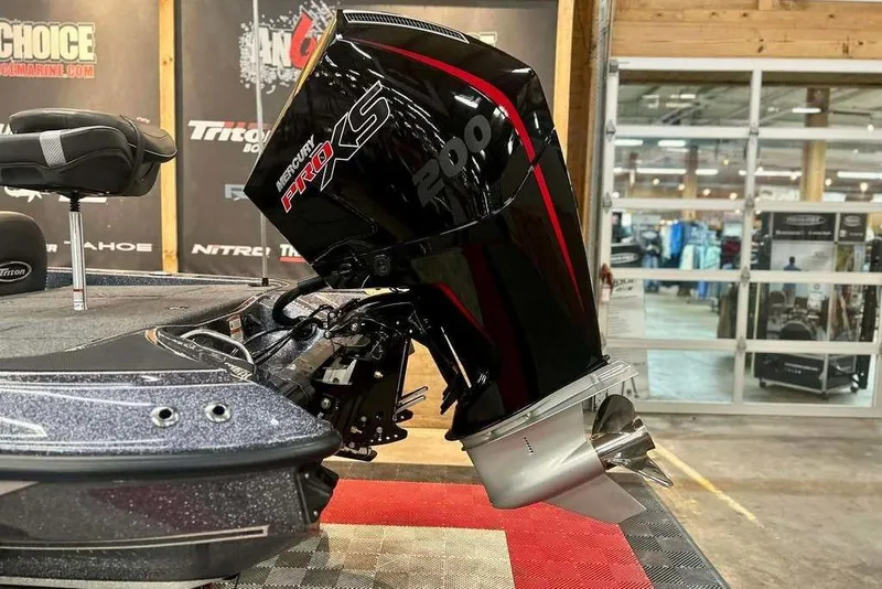 Slide: The Image of 2026 Triton 18 TrX boat with Mercury Pro XS 200 engine in showroom. - 5