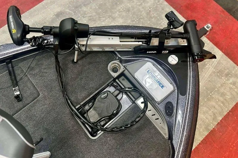 Slide: The Image of Triton 18 TrX 2026 boat deck with Minn Kota trolling motor and Lowrance electronics. - 9