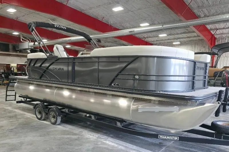 The Image of 2026 Sylvan Mirage X5 pontoon boat in showroom, featuring sleek design and modern amenities. - 0
