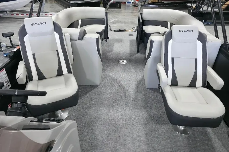 Slide: The Image of 2026 Sylvan Mirage X5 boat dashboard with steering wheel and control panel. - 12