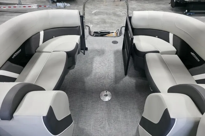 Slide: The Image of 2026 Sylvan Mirage X5 boat interior with modern seating and steering console. - 13
