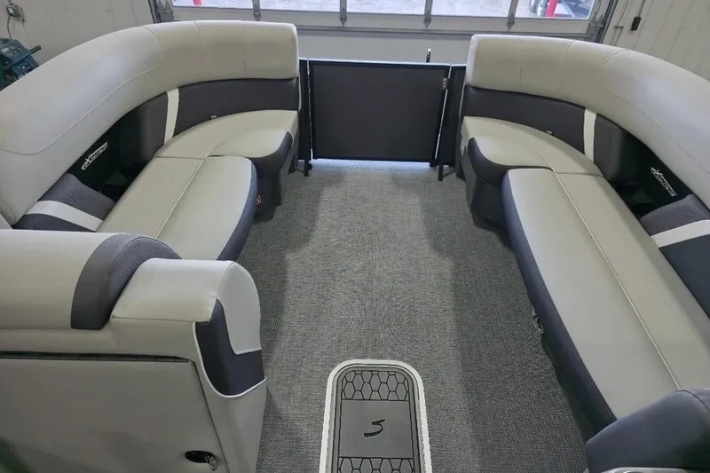 Slide: The Image of 2026 Sylvan Mirage X5 boat interior with luxurious seating and modern design. - 7