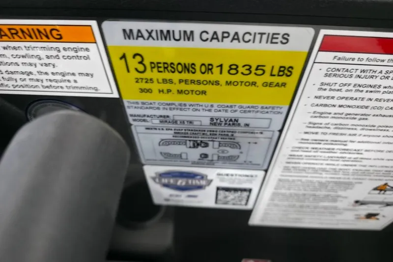 Slide: The Image of 2026 Sylvan Mirage X5 boat interior with modern steering console and comfortable captain's chair. - 9