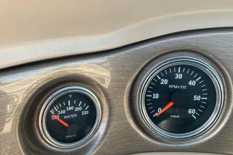 Slide: The Image of Dashboard gauges of a 2007 Bryant 206 boat, showing water temperature and RPM. - 11