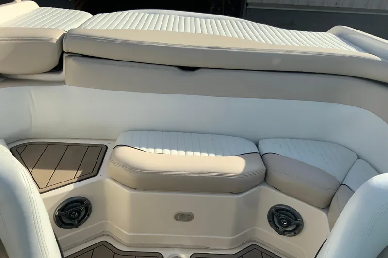Slide: The Image of Interior seating of a 2007 Bryant 206 boat with beige upholstery. - 9